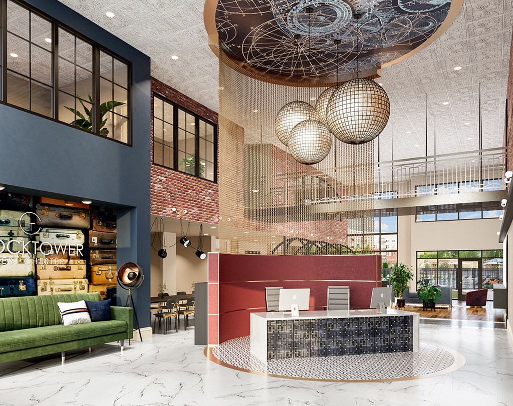 the lobby of a hotel with a reception desk and disco balls