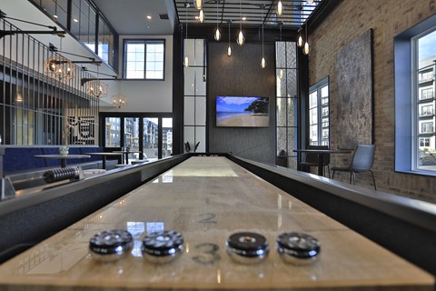 a shuffleboard table in the middle of a room