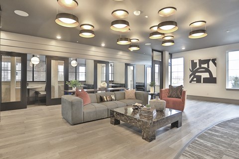 a large living room with couches and a table