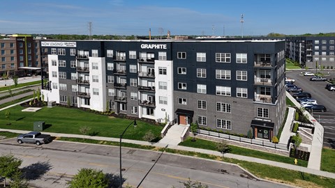 A large multi-story building with the name "GRAPHTHE" on the side.
