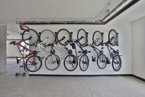 A wall with a mural of bicycles on it.