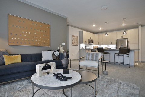 an open floor plan with a living room and a kitchen