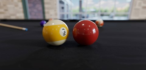 A pool table with a red ball and a yellow ball with a black dot on it.