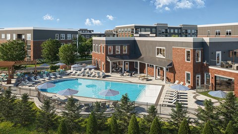 A large swimming pool surrounded by lounge chairs and trees.