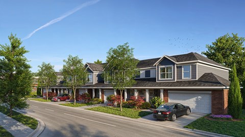 A row of houses with a car parked in front of the last one.