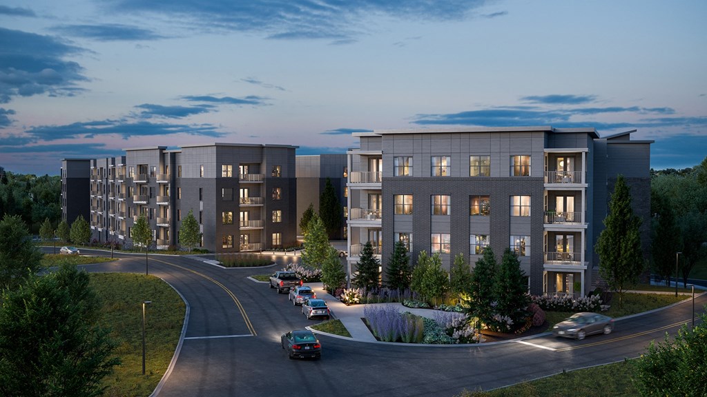 an aerial view of an apartment complex at dusk