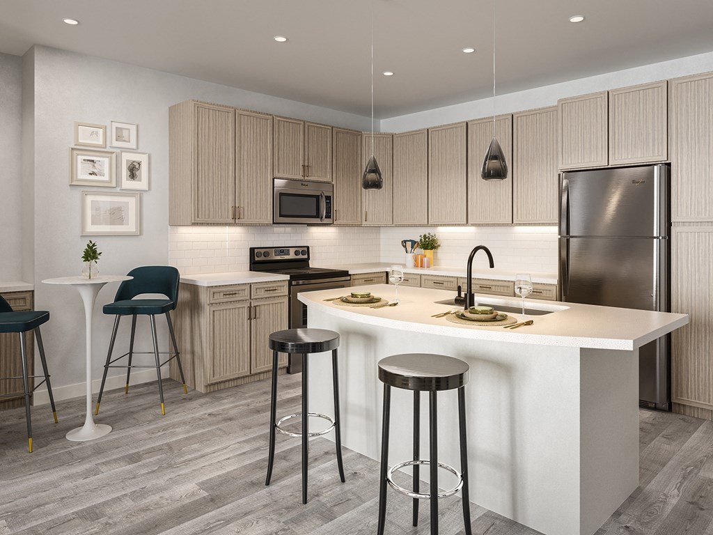 a kitchen with a center island and stools