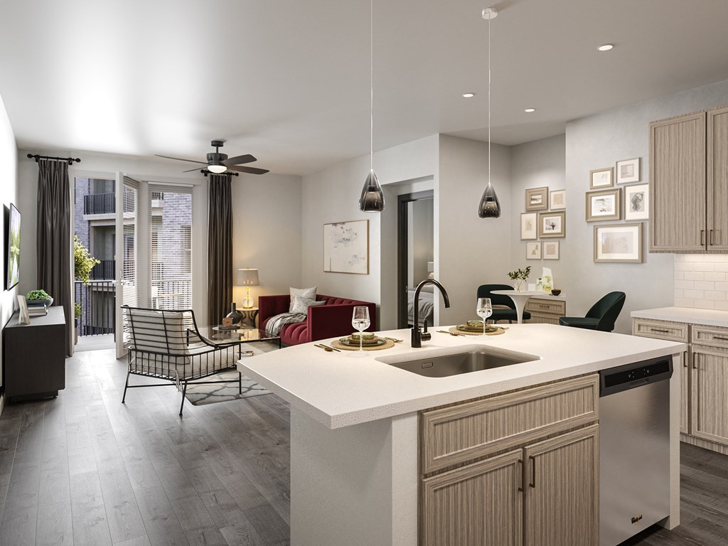 a kitchen with an island and a living room with a couch