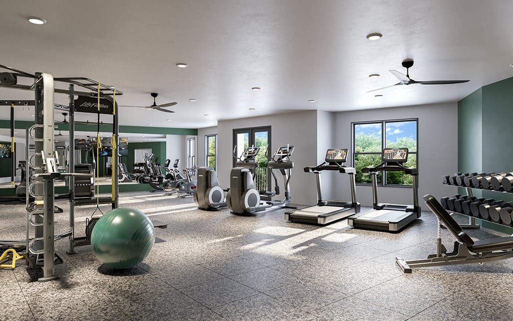 Full circuit fitness center with yoga/Pilates/HIIT studio and individual workout pods.