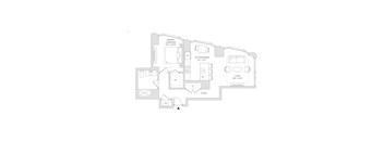 A floor plan of a house with a primary bedroom, kitchen, dining area, living room, and foyer.