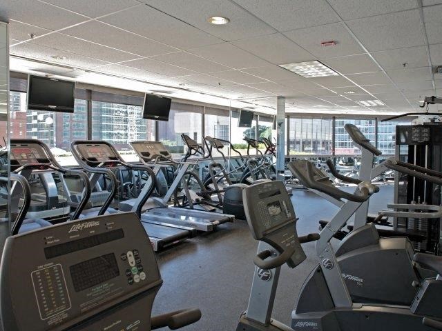 a gym with a large amount of exercise equipment