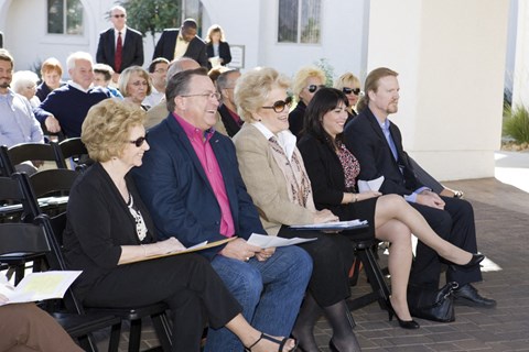 a group of people sitting in chairs in an audience