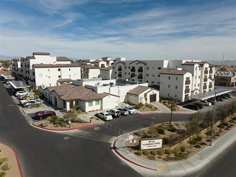 A view of a housing complex with a sign that says Flamingo Fires.