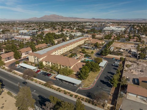 A large building with a parking lot in front of it.