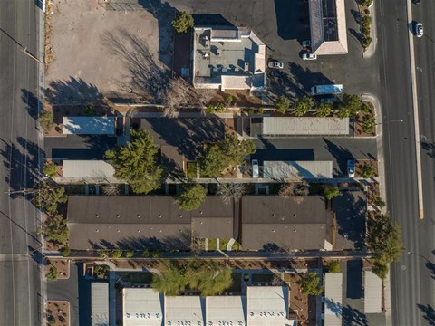 A bird's eye view of a residential area with houses and trees.