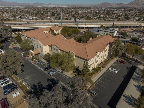 A large building with a parking lot in front of it.