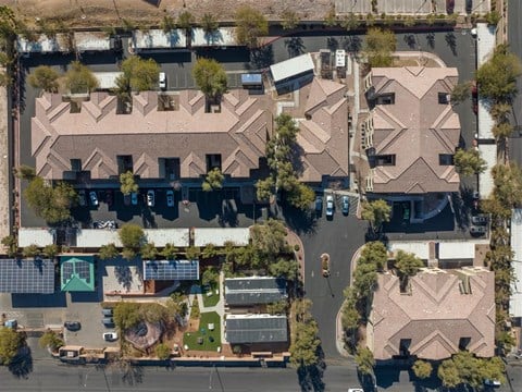 A bird's eye view of a residential area with houses and streets.