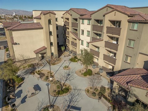 A large apartment complex with a courtyard in the middle.