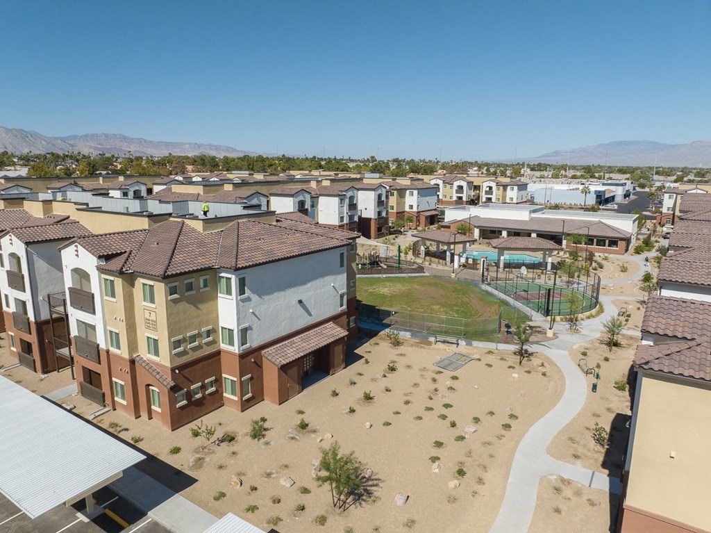 an aerial view of a neighborhood with houses and a playground