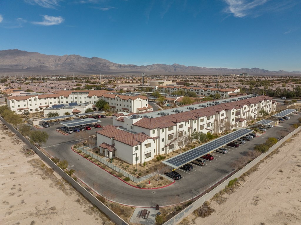 an aerial view of an apartment complex in the desert