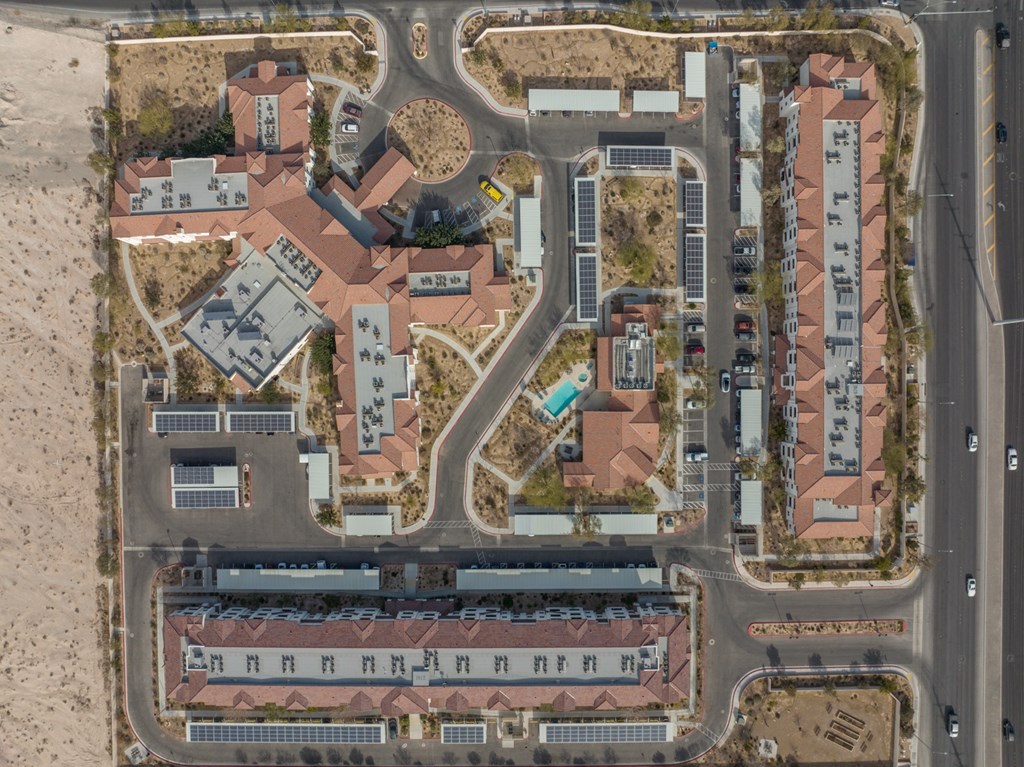 an aerial view of a city with buildings and roads