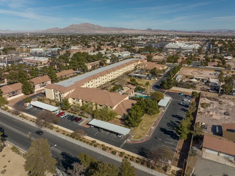 A large building with a parking lot in front of it.