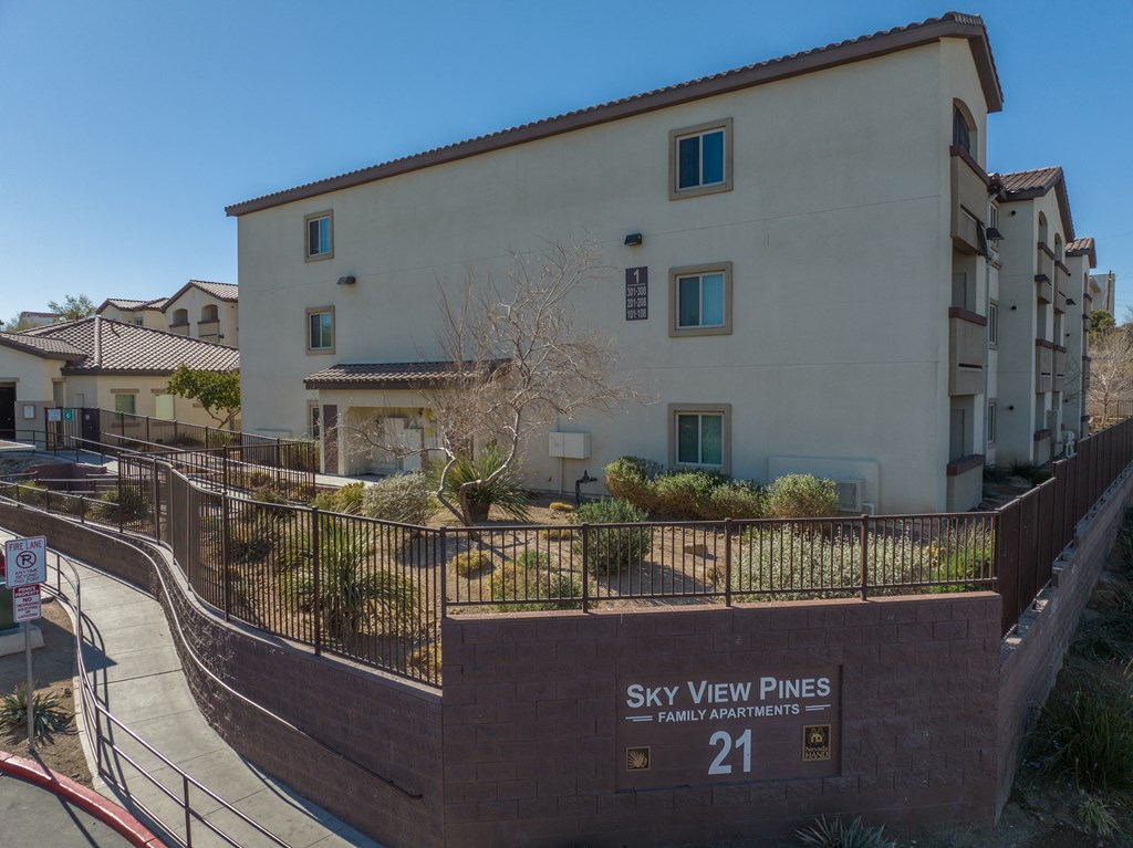 an apartment building with a sign that says sky view pines 21