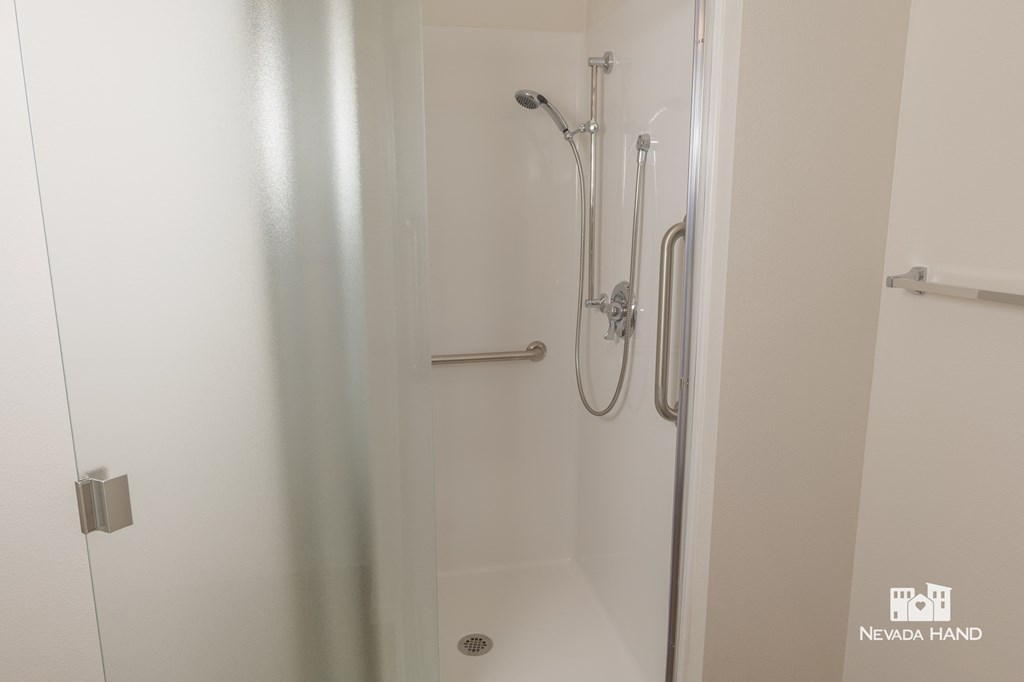a shower in a small room with a shower curtain