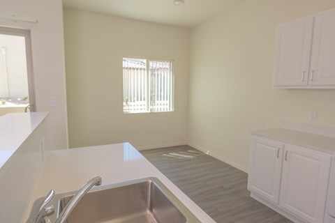 A kitchen with a sink and cabinets.