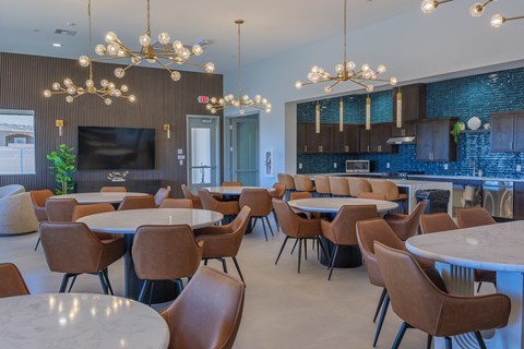 A modern dining area with brown chairs and a white table.