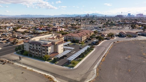 A large building with a parking lot in front of it.