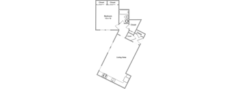 A drawing of a house layout with a bedroom, living area, and closets.