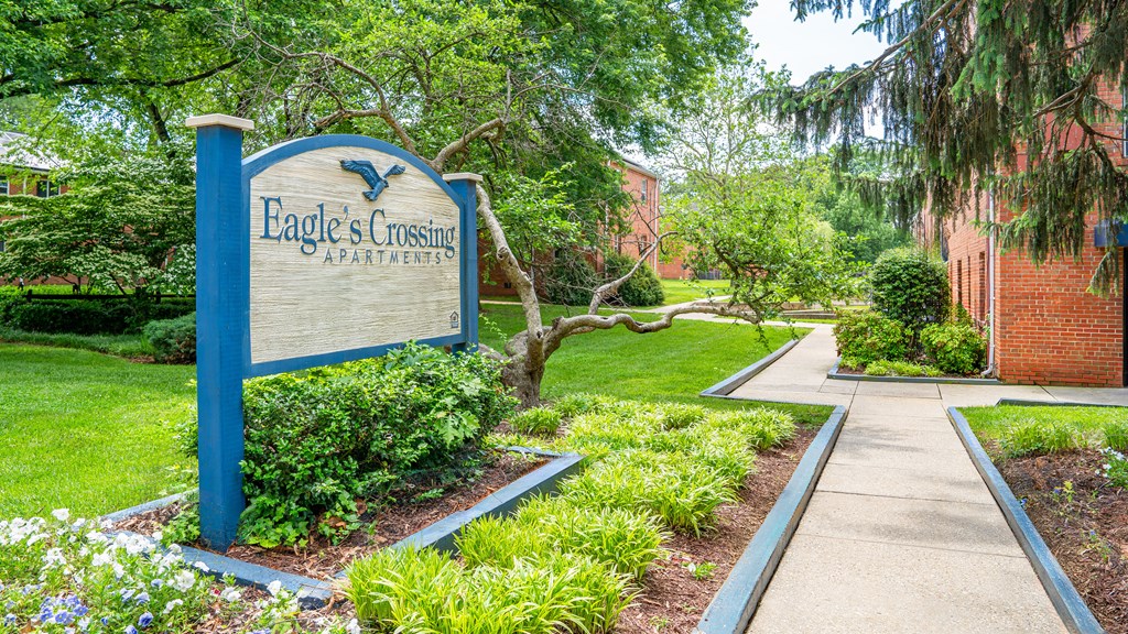 A blue sign at Eagles Crossing Apartments, Washington, DC