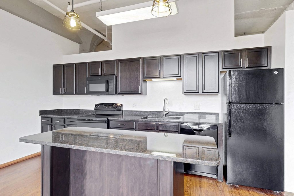a kitchen with stainless steel appliances and a counter top
