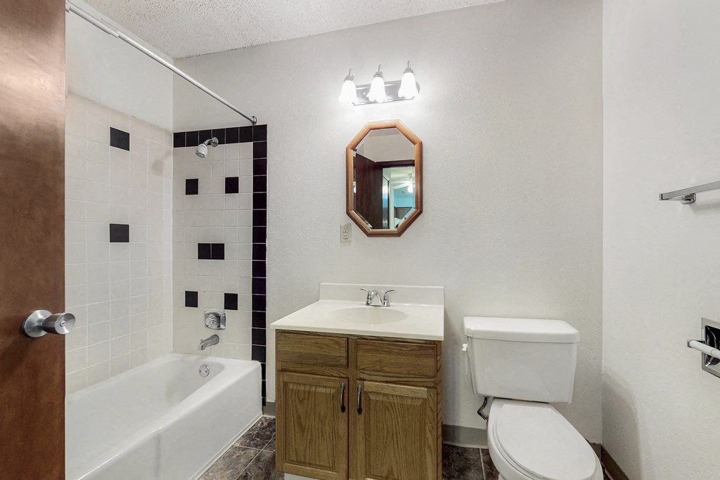 a bathroom with a sink toilet and a tub