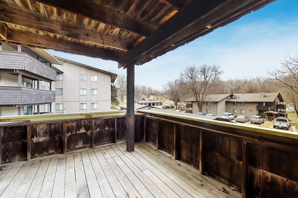 the deck of a condo with a view of the city