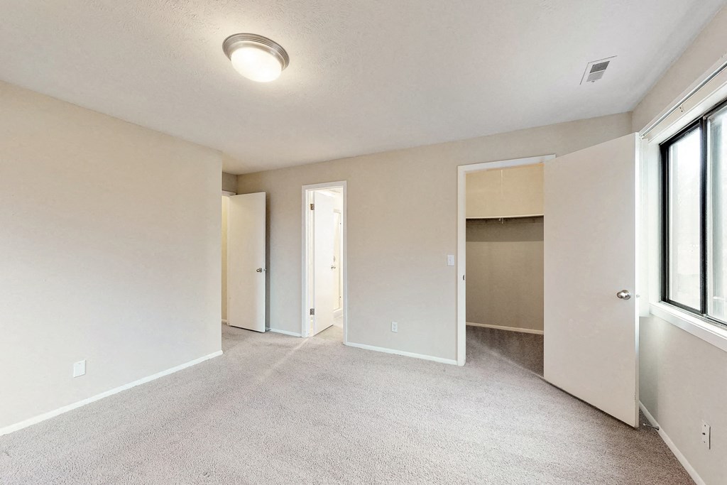 the spacious living room and dining room in a new home