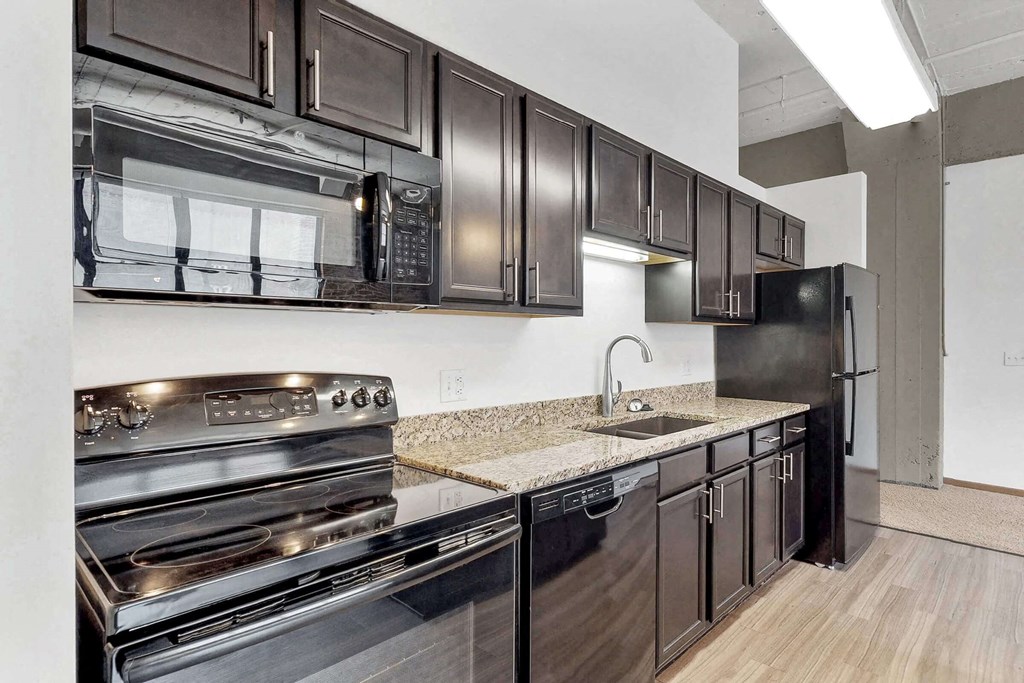 a kitchen with stainless steel appliances and a counter top