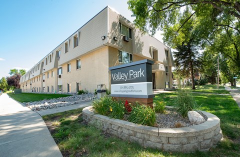 A building with a sign that says Valley Park in front of it.