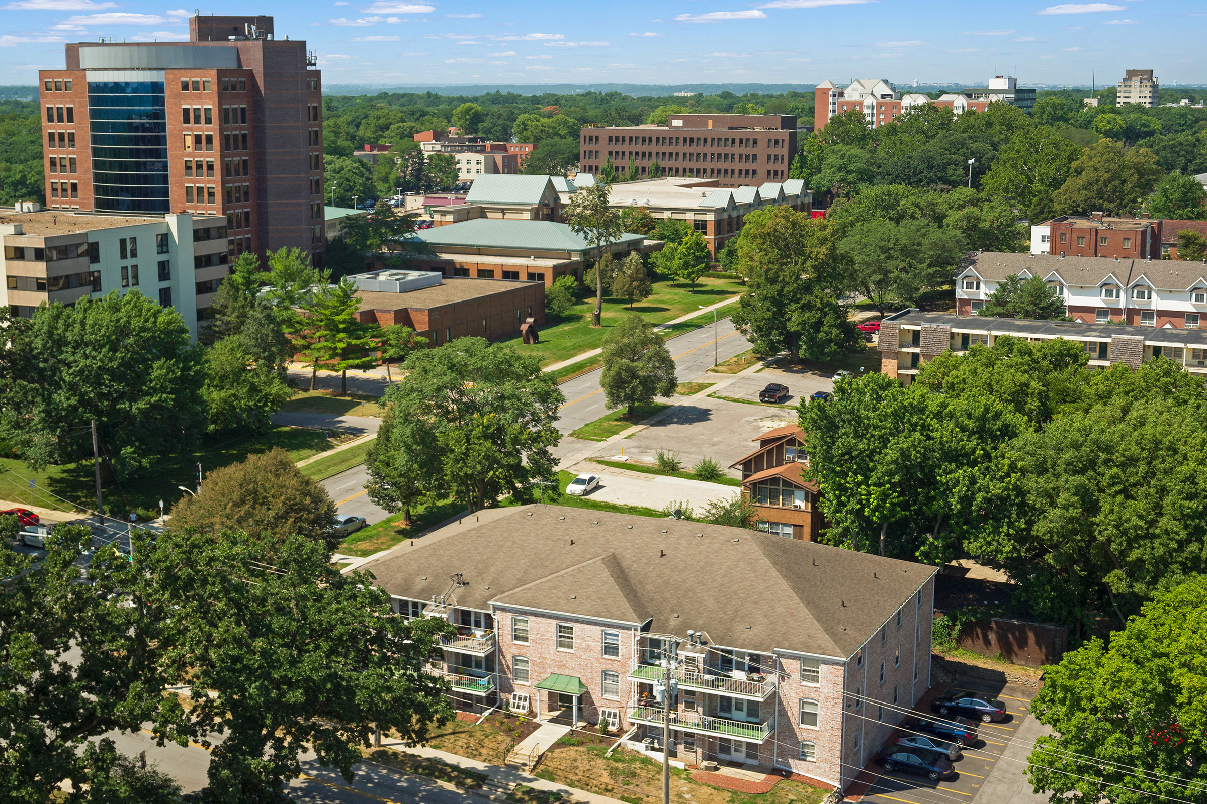 an aerial view of a city with buildings and trees