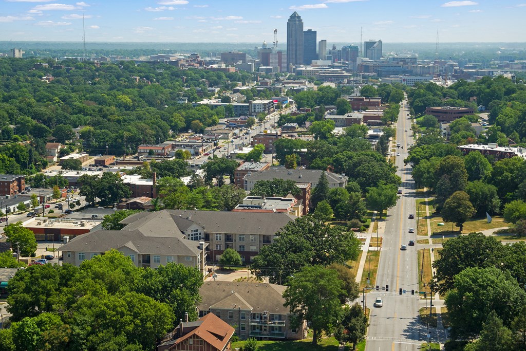 an aerial view of a city with a city skyline in the distance