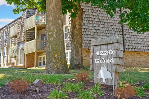 a sign that reads 4220 grand in front of a building