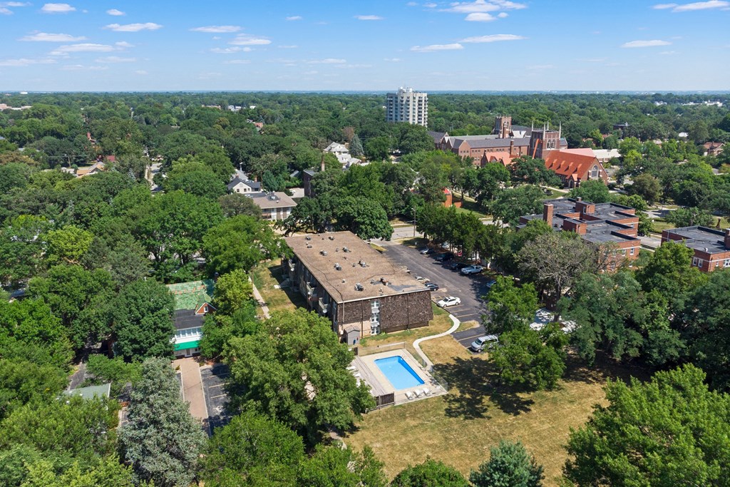 an aerial view of a city with buildings and trees