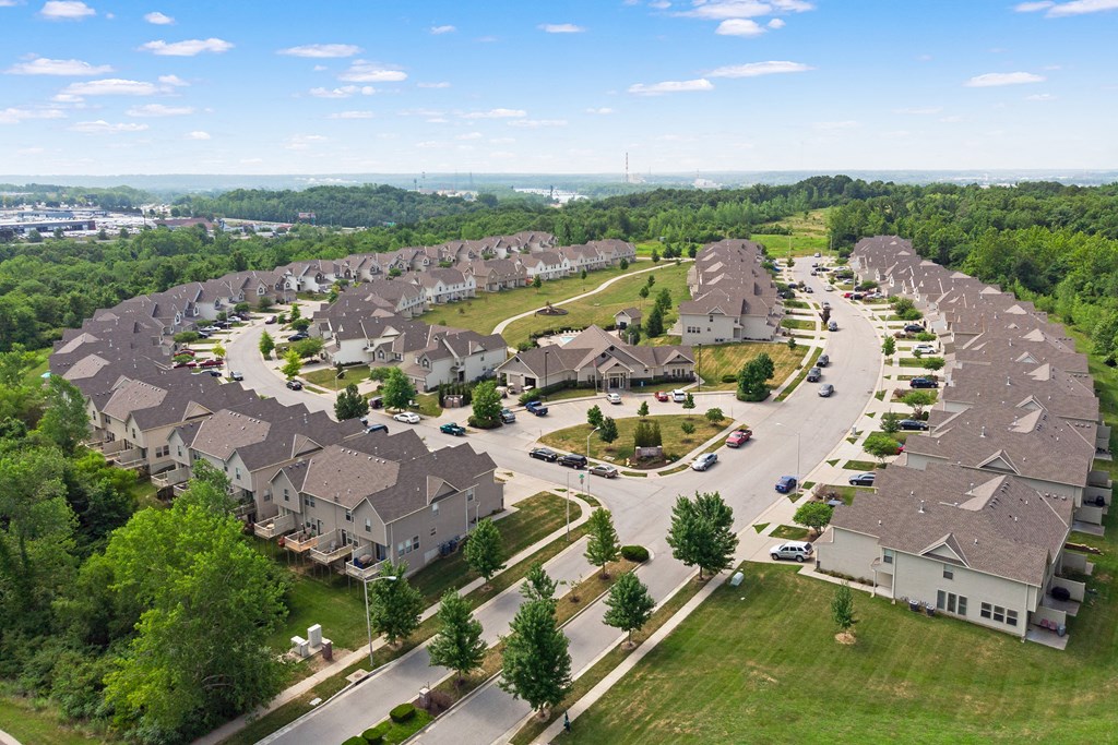 an aerial view of a neighborhood with rows of houses