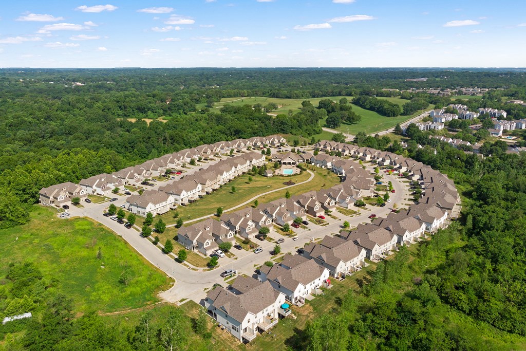 an aerial view of a subdivision with rows of houses