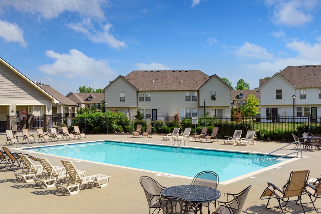 our apartments offer a swimming pool with chairs and tables
