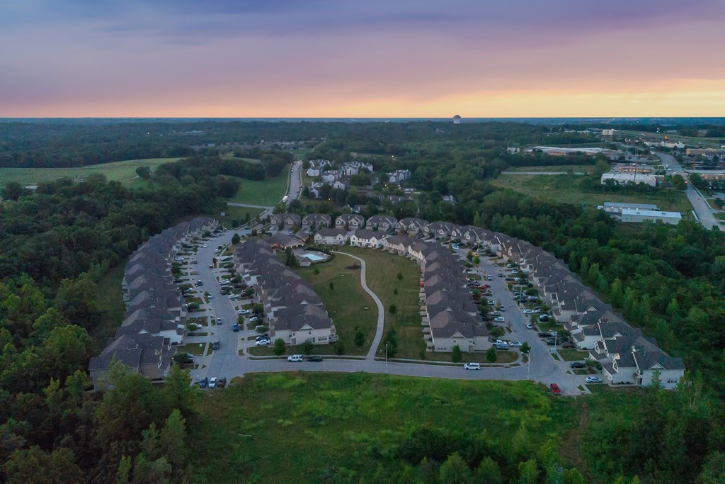 an aerial view of a parking lot at dusk