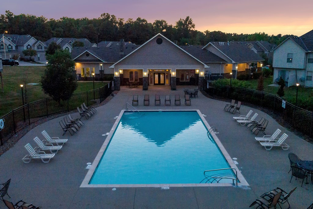 an aerial view of a swimming pool at dusk