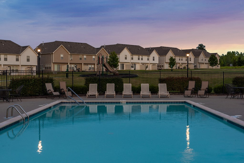 our apartments have a large swimming pool at dusk
