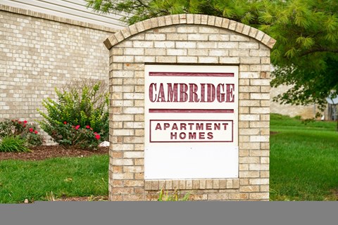 a sign in front of a house that says apartment homes